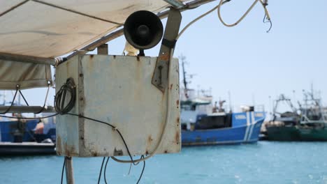A-horn-speaker-on-a-small-fishing-boat-at-the-marina