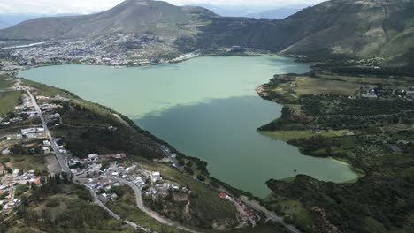 Aerial-view-of-Ibarra-Yawarkucha-or-Yawar-Kucha-laguna-lake-drone-fly-above-mountains-lake-during-sunny-day