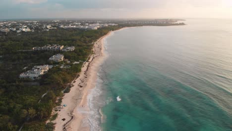 Playa-del-Carmen-sandy-beach-with-tropical-sea-on-the-coast-of-Mexico,-aerial-cinematic-view