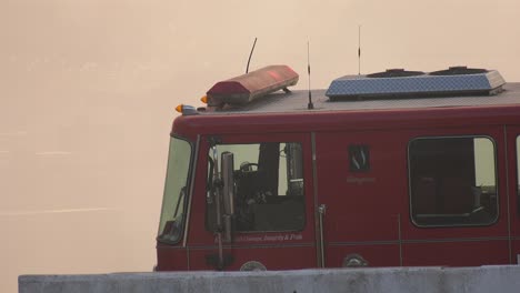 Fire-truck-illuminated-with-large-smoke-cloud