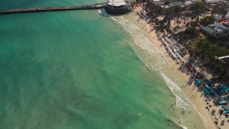 Aerial-view-of-turquoise-sea-water-at-the-beach-Playa-del-Carmen-in-Mexico