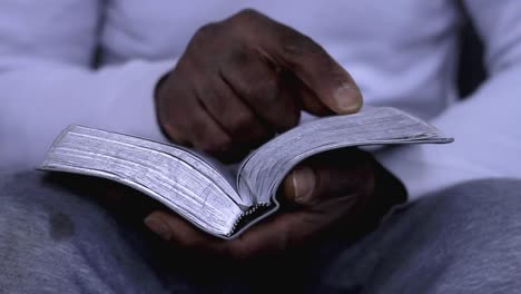 man-praying-to-god-with-hands-together-with-bible-Caribbean-man-praying-with-white-background-stock-footage