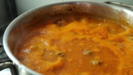 Close-Up-View-Of-Tomato-Soup-Is-Bubbling-In-A-Pan