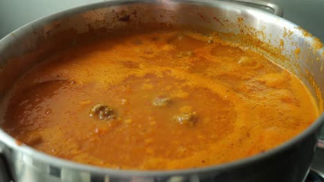 Close-Up-View-Of-Tomato-Soup-Slowly-Simmering-In-A-Pan