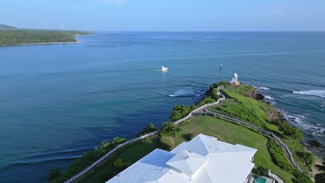 Aerial-flight-over-luxury-Senator-Resort-Hotel-and-cruising-boats-during-sunny-day
