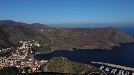 PortBou-seafaring-tradition-town,-aerial-drone-view-of-sensational-landscape