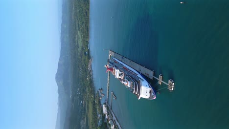 Vertical-drone-shot-of-Cruise-Ship-parking-at-dock-of-Amber-Cove-Terminal-in-Puerto-Plata