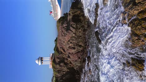 Gazebo-on-rocky-promontory-of-Senator-Puerto-Plata-Spa-Resort-with-cruise-ship-in-background,-Dominican-Republic