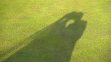 Shadow-of-a-couple-kissing-on-the-grass