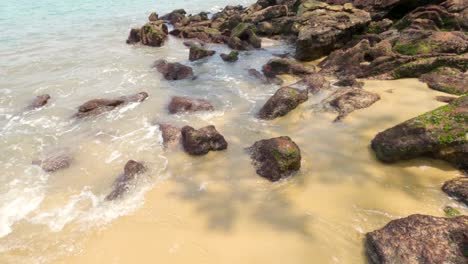 Ocean-waves-crashing-on-the-beach-sand-and-coastal-beach-stones
