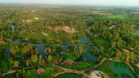 Aerial-dolly-out-revealing-the-enchanting-village-of-Amatciems-between-lakes-in-Latvia