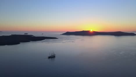Aerial-sunset-seaview-panorama-over-Therasia-island-in-Santorini,-Greece