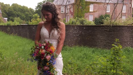 Wedding-Photographer-Taking-Photo-Of-Beautiful-Bride-In-Outdoor-Landscape---medium-shot