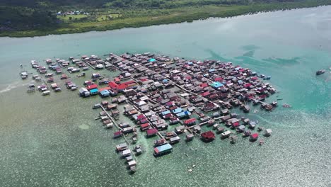 Aerial-view-of-a-beautiful-seawater-village-in-Kampung-Bajau,-Sulawesi,-Indonesia