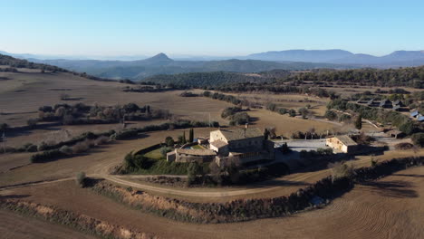 Aerial-drone-view-of-traditional-countryside-spanish-rural-masia,-forward