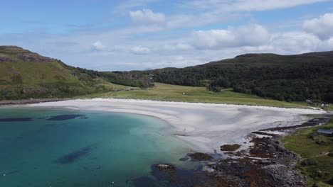 Stunning-White-Sand-Beach-and-Blue-Sea-at-Calgary-Bay-on-Isle-of-Mull-Inner-Hebrides-Scotland-Aerial-Drone-Footage-4K-HD-Rise-Up