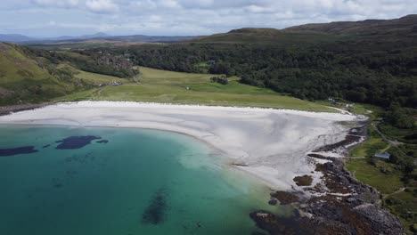 Stunning-White-Sand-Beach-and-Blue-Sea-at-Calgary-Bay-on-Isle-of-Mull-Inner-Hebrides-Scotland-Aerial-Drone-Footage-4K-HD-Fly-Over