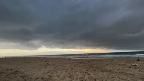 Timelapse-shot-at-the-coastal-beach-capturing-fast-moving-dark-and-ominous-storm-clouds-in-the-sky,-wet-and-wild-season-approaching-this-summer,-extreme-weather-forecasted-in-Australia