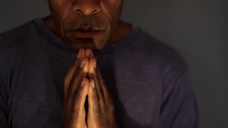 man-praying-to-god-with-hands-together-on-grey-background-stock-video