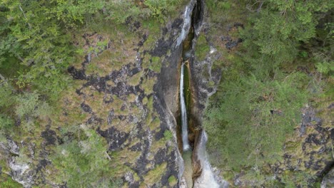 Overhead-Drone-view-of-waterfall-running-into-Almach-gorge-Bavarian-Alps-Germany