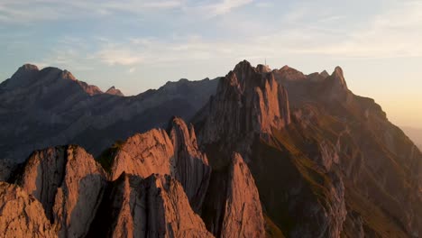 Flying-towards-Schafler-Ridge-in-Appenzell,-Switzerland-during-sunset-in-summer