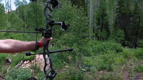 Slow-motion-shot-of-an-archer-shooting-an-arrow-in-the-mountains-2