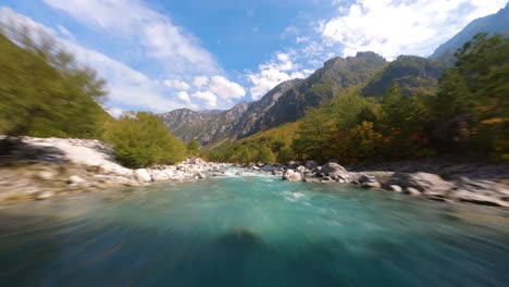 Proximity-flight-of-FPV-drone-over-a-mountain-river-in-Theth,-Albania