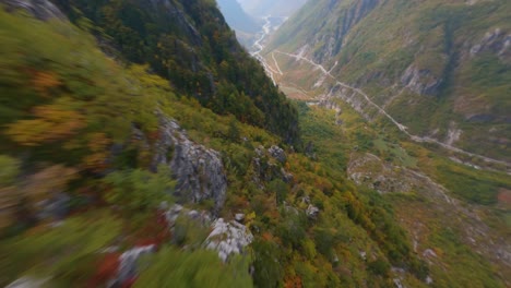 FPV-drone-dives-down-a-steep-mountain-in-Theth,-Albania