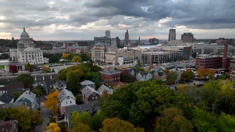 aerial-over-autumn-colors-on-trees-pushing-toward-the-providence-rhode-island-skyline