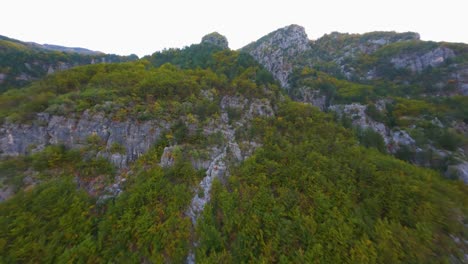 Drone-flying-up-a-mountain-near-Theth,-Albania