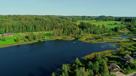 Drone-shot-flying-over-beautiful-countryside-and-green-forests,-Norway