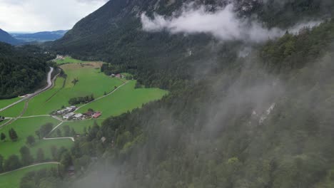 Drone-flying-through-clouds-to-reveal-green-valley-Bavaria-Germany-Drone-Aerial-view