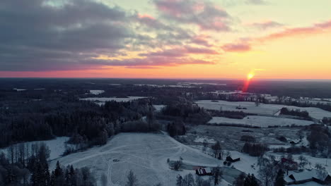 Beautiful-drone-shot-of-snow-covered-nature-landscape-at-sunset