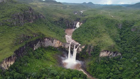 aerial-view-of-a-huge-double-waterfall-in-the-forest---Chapada-dos-Veadeiros,-Goias---Brazil