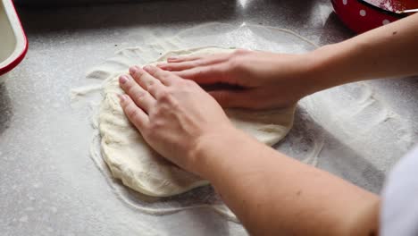 Woman-making-home-made-pizza-at-home