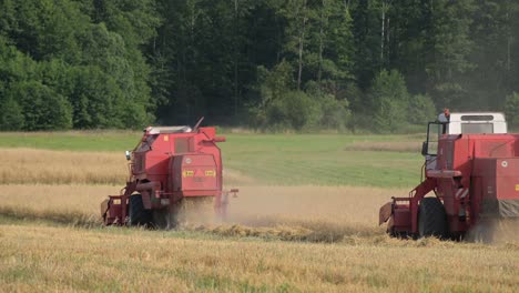 harvesting-red-machine-working-together-as-a-team-in-the-harvesting-season