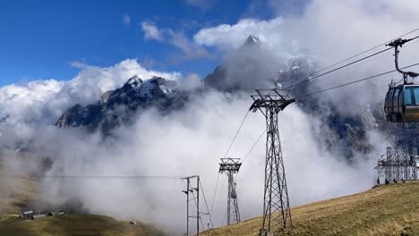 Timelapse-of-cable-cars-at-top-station-of-Grindelwald-First-in-front-of-Wetterhorn-mountain