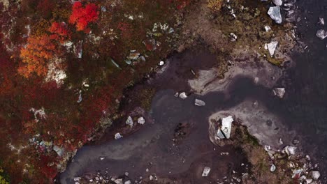 Overhead-View-Of-Rocky-River-Stream-During-Autumn-Near-Strynefjellet-In-Norway
