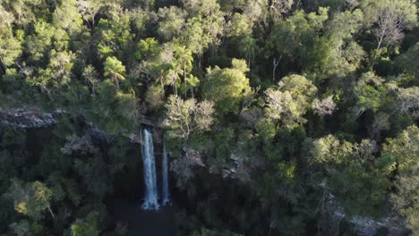 Drone-flying-over-Salto-Arrechea-waterfall-in-forest-at-border-between-Argentina-and-Brazil,-Iguazu-falls-National-Park