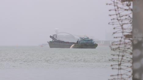 A-ship-is-seen-at-the-waterfront-under-heavy-rain-during-a-severe-tropical-typhoon-storm-signal-T8-Ma-On,-which-sustained-winds-of-63-miles-and-damaged-the-city-of-Hong-Kong