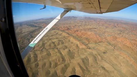 Pov-of-Arkaroola-landscape-from-light-aircraft,-Rugged-terrain-from-flight-experience,-Australia