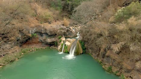 Flying-Low-Towards-A-Small-Waterfall-At-Cascada-De-Comala-Park-Near-Chiquilistlán,-Jalisco,-Mexico