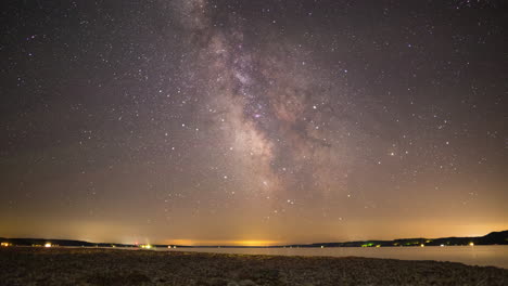 Time-lapse-of-the-Milky-Way-moving-across-the-sky-above-a-lake