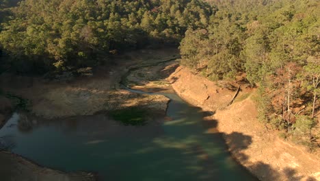 Aerial-View-Of-El-Calaque-Dam-Draining-During-Dry-Season