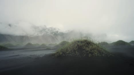 Slow-panning-shot-of-the-misty-early-morning-at-mysterious-Stokksnes-beach-in-Iceland-in-4k