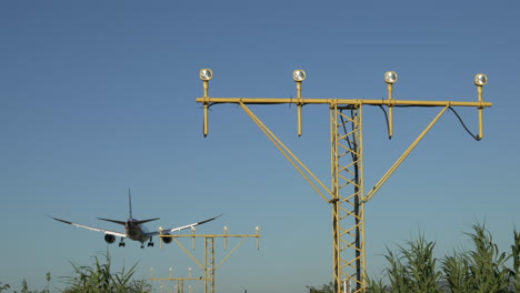 Rear-View-Of-Commercial-Airplane-About-To-Land-At-El-Prat-Barcelona-Airport