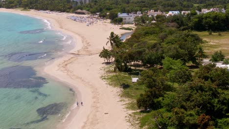 Dramatic-bird's-eye-view-orbiting-towards-gorgeous-beach-in-Dominican-Republic