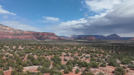Clouds-Rolling-Over-Weathered-Sandstone-Mountains-In-Sedona-Deserts-In-Arizona