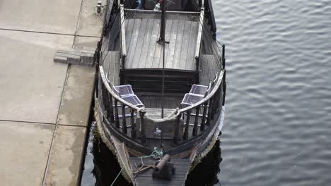Old-Wooden-Pirate-Ship-For-Touring-on-Jelgava-river-Moored,-Latvia