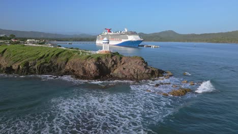 Romantic-gazebo-on-rocky-cliff-of-Senator-Puerto-Plata-Spa-Resort-with-cruise-ship-in-background,-Dominican-Republic